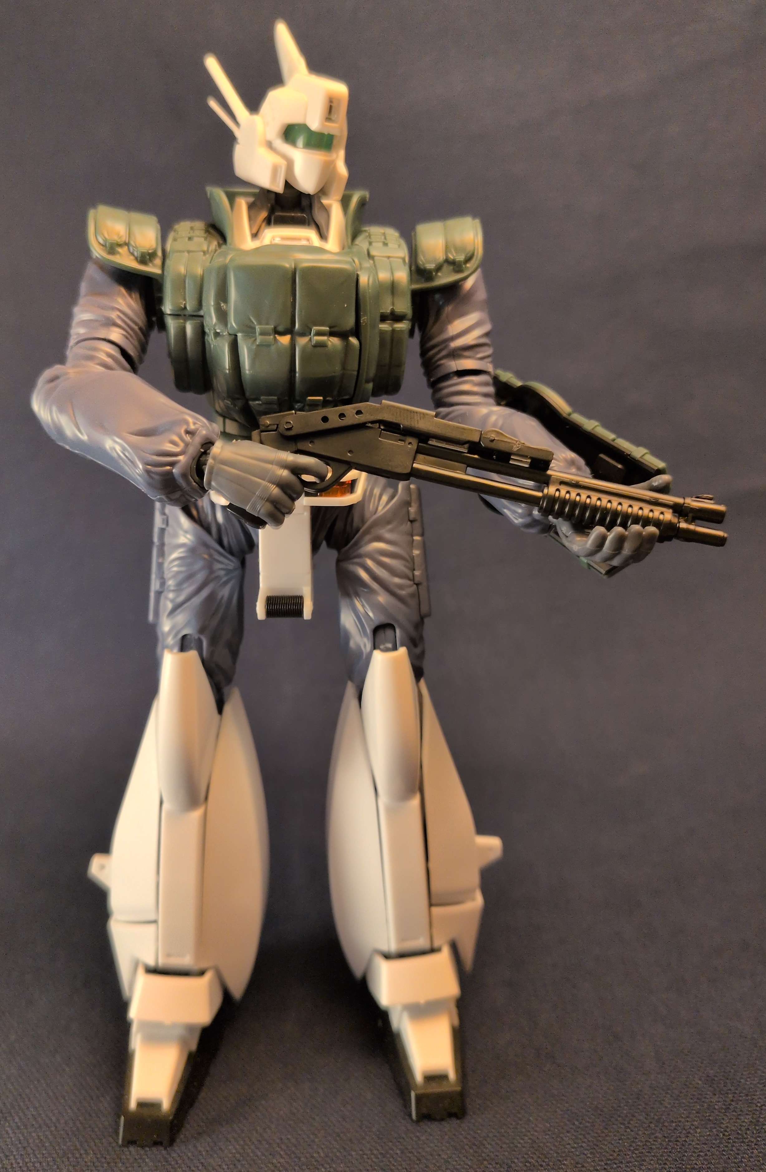patlabor with riotgun in low ready position