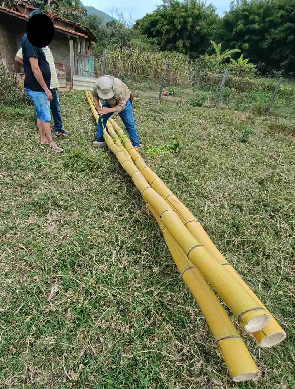 Akelas lashing the tripod legs together