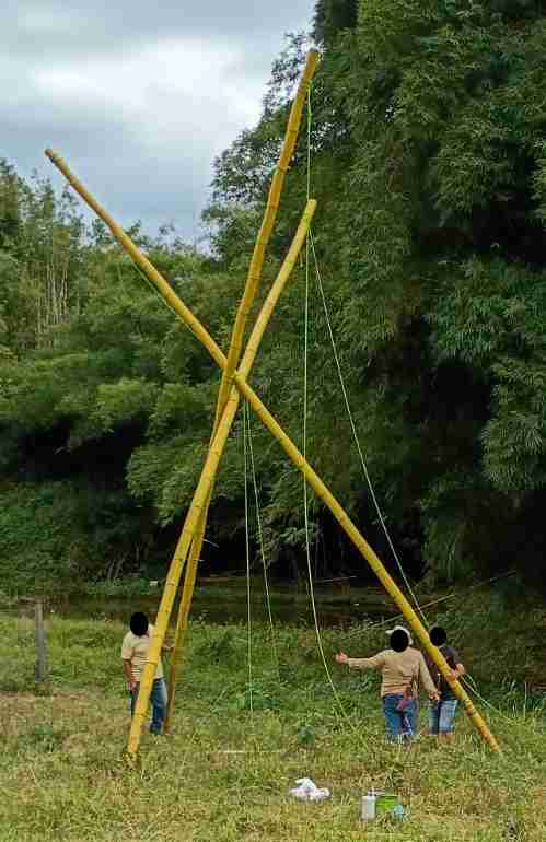 Akelas, FIL, and cousin work to adjust the tripod legs
